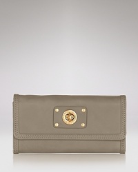 Part of the Totally Turnlock collection from MARC BY MARC JACOBS. A single turnlock lends urbane sophistication to this chic calfskin wallet. Part of the Totally Turnlock collection from MARC BY MARC JACOBS. A single turnlock lends urbane sophistication to this chic calfskin wallet.