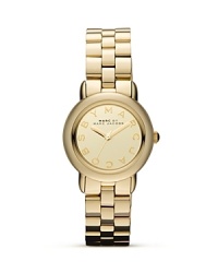 Delicately sized yet big on shine. This plated metallic watch from MARC BY MARC JACOBS flaunts the brand's enviable aesthetic with everyday allure. Delicately sized yet big on shine. This plated metallic watch from MARC BY MARC JACOBS flaunts the brand's enviable aesthetic with everyday allure.