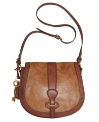 Grab hold of great style with this vintage-inspired flap bag from Fossil. A saddle silhouette, goldtone hardware and a signature key charm add the perfect finishing touches to this unique design. Grab hold of great style with this vintage-inspired flap bag from Fossil. A saddle silhouette, goldtone hardware and a signature key charm add the perfect finishing touches to this unique design.
