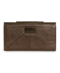 Sophisticated and stylish. This refined wallet by Kenneth Cole Reaction features an all-over slight sheen, signature plaque at front and sleek kiss lock closure. Sophisticated and stylish. This refined wallet by Kenneth Cole Reaction features an all-over slight sheen, signature plaque at front and sleek kiss lock closure.