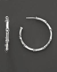 From the Bamboo collection, medium hoop earrings inspired from bamboo, designed by John Hardy. From the Bamboo collection, medium hoop earrings inspired from bamboo, designed by John Hardy.