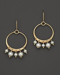 Cultured freshwater pearls dangle from 14K yellow gold hoops. Cultured freshwater pearls dangle from 14K yellow gold hoops.