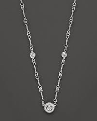 A white gold necklace has double-sided diamond stations; with signature ruby accent. Designed by Roberto Coin. A white gold necklace has double-sided diamond stations; with signature ruby accent. Designed by Roberto Coin.