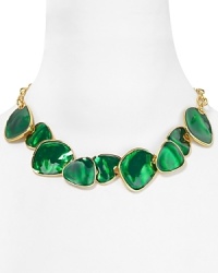 Hammered enamel discs are a bright, vintage-inspired complement to a gleaming 22-karat gold chain on this mod-meets-modern Kenneth Jay Lane bib necklace. Hammered enamel discs are a bright, vintage-inspired complement to a gleaming 22-karat gold chain on this mod-meets-modern Kenneth Jay Lane bib necklace.