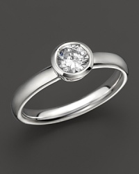 Extraordinary brilliance. This beautifully crafted diamond ring features a bezel-set brilliant round stone. Extraordinary brilliance. This beautifully crafted diamond ring features a bezel-set brilliant round stone.