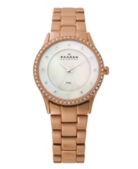 Smooth steel gets a warm makeover on this watch by Skagen Denmark. Rose-gold-plated stainless steel bracelet and round case. Bezel crystallized with Swarovski elements. Mother-of-pearl dial features crystal accents at markers, three silver tone hands and black logo at twelve o'clock. Quartz movement. Water resistant to 30 meters. Limited lifetime warranty. Smooth steel gets a warm makeover on this watch by Skagen Denmark. Rose-gold-plated stainless steel bracelet and round case. Bezel crystallized with Swarovski elements. Mother-of-pearl dial features crystal accents at markers, three silver tone hands and black logo at twelve o'clock. Quartz movement. Water resistant to 30 meters. Limited lifetime warranty.