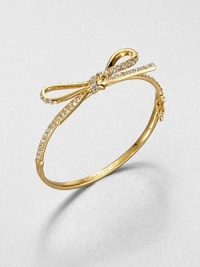 From the Skinny Mini Collection. A dainty bow, outlined in sparkling crystals, is like gift wrapping for your wrist.CrystalGoldtoneDiameter, about 2.25Hinged with push-lock safety claspImported From the Skinny Mini Collection. A dainty bow, outlined in sparkling crystals, is like gift wrapping for your wrist.CrystalGoldtoneDiameter, about 2.25Hinged with push-lock safety claspImported