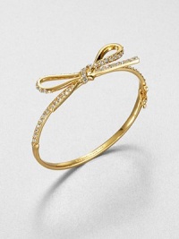 From the Skinny Mini Collection. A dainty bow, outlined in sparkling crystals, is like gift wrapping for your wrist.CrystalGoldtoneDiameter, about 2.25Hinged with push-lock safety claspImported