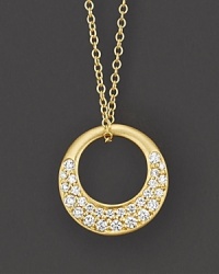 Pavé diamonds gleam from a circle of 18K yellow gold. Pavé diamonds gleam from a circle of 18K yellow gold.