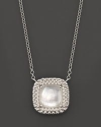 This sterling silver pendant, gleaming with a doublet of rock crystal over mother-of-pearl, represents the love between a mother and her child. By Di MODOLO. This sterling silver pendant, gleaming with a doublet of rock crystal over mother-of-pearl, represents the love between a mother and her child. By Di MODOLO.
