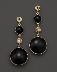 Sparkling diamonds highlight these drop earrings in bold black enamel and 18K yellow gold. Sparkling diamonds highlight these drop earrings in bold black enamel and 18K yellow gold.