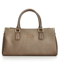 Ladylike with elegant accents, this petite satchel from Calvin Klein stylishly totes your everyday essentials with ease. Sumptuous Saffiano leather is the perfect backdrop for subtle golden hardware and detail stitching. It's the perfect accessory for any occasion, Ladylike with elegant accents, this petite satchel from Calvin Klein stylishly totes your everyday essentials with ease. Sumptuous Saffiano leather is the perfect backdrop for subtle golden hardware and detail stitching. It's the perfect accessory for any occasion,
