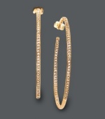 Step it up in the sparkle department. Glam hoops by Eliot Danori feature sparkling crystals in an in-and-out pattern. Crafted in 18k gold tone mixed metal. Approximate diameter: 2 inches.