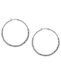 Twice more, with feeling. BCBGeneration's hoop earrings, crafted from silver-tone mixed metal, get stylish geometric accents for a textured feel that's sure to please. Twice more, with feeling. BCBGeneration's hoop earrings, crafted from silver-tone mixed metal, get stylish geometric accents for a textured feel that's sure to please.