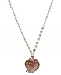 Make a heartfelt statement with this pendant from Betsey Johnson. Crafted from antique gold-tone mixed metal, the necklace shines bright with glass crystal accents, and the glittery heart pendant only adds to the lustrous effect. Item comes packaged in a signature Betsey Johnson Gift Box. Approximate length: 16 inches + 3-inch extender. Approximate drop: 1-3/4 inches. Make a heartfelt statement with this pendant from Betsey Johnson. Crafted from antique gold-tone mixed metal, the necklace shines bright with glass crystal accents, and the glittery heart pendant only adds to the lustrous effect. Item comes packaged in a signature Betsey Johnson Gift Box. Approximate length: 16 inches + 3-inch extender. Approximate drop: 1-3/4 inches.
