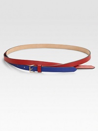 A graphic, colorblocked style with a cross-over design and a brass buckle. Width, about ½Made in Italy A graphic, colorblocked style with a cross-over design and a brass buckle. Width, about ½Made in Italy