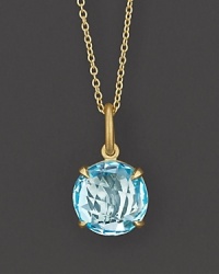 Sky blue topaz sparkles in a 18K yellow gold setting. Sky blue topaz sparkles in a 18K yellow gold setting.
