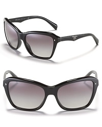 Go for beach chic in Prada's oversized cat eye sunglasses with metal studs and logo detail at temples. Go for beach chic in Prada's oversized cat eye sunglasses with metal studs and logo detail at temples.