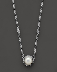 From the Luna Collection, an elegant pearl pendant with silver accents hangs from this chunky 2-station link necklace.Designed by Lagos.