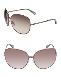 Add a funky element to any ensemble with DIANE von FURSTENBERG's twisted metal frame sunglasses. Add a funky element to any ensemble with DIANE von FURSTENBERG's twisted metal frame sunglasses.