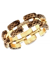 Sink your teeth into this chic bracelet from Ann Klein. The slip-on design features rectangular links covered in snake skin leather. Crafted in gold tone mixed metal. Approximate length: 8 inches. Sink your teeth into this chic bracelet from Ann Klein. The slip-on design features rectangular links covered in snake skin leather. Crafted in gold tone mixed metal. Approximate length: 8 inches.