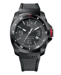 From business casual at the office to beach casual at the ocean, this watch by Tommy Hilfiger has you covered. Black silicone strap and round black ion-plated stainless steel case. Black bezel with white numerals and red iconic flag logo. Brushed black dial features stick indices, numerals at twelve, three, six and nine o'clock, date window at four o'clock, luminous hands and text logo. Quartz movement. Water resistant to 30 meters. Ten-year limited warranty. From business casual at the office to beach casual at the ocean, this watch by Tommy Hilfiger has you covered. Black silicone strap and round black ion-plated stainless steel case. Black bezel with white numerals and red iconic flag logo. Brushed black dial features stick indices, numerals at twelve, three, six and nine o'clock, date window at four o'clock, luminous hands and text logo. Quartz movement. Water resistant to 30 meters. Ten-year limited warranty.