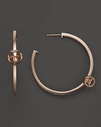 Di MODOLO's sleek and modern earrings show off the brand's signature shape on a smooth, clean hoop. Di MODOLO's sleek and modern earrings show off the brand's signature shape on a smooth, clean hoop.