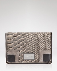 Juicy Couture masters the mixed media trend with this leather card case. It's perfectly practical with pockets for your precious plastic. Juicy Couture masters the mixed media trend with this leather card case. It's perfectly practical with pockets for your precious plastic.