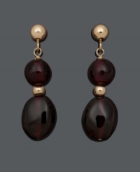 Get a double dose of style in rich, red hues. These daring drops feature two, graduated (6 mm and 6 mm x 8 mm), garnet beads (14 ct. t.w.) in a 14k gold post setting. Approximate drop: 3/4 inch. Get a double dose of style in rich, red hues. These daring drops feature two, graduated (6 mm and 6 mm x 8 mm), garnet beads (14 ct. t.w.) in a 14k gold post setting. Approximate drop: 3/4 inch.