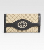 Signature logo jacquard in a foldover silhouette, finished with leather trim and GG hardware.Magnetic snap flap pocketCenter zip pocketTwo inner compartmentsThirteen credit card slotsFully lined7½W X 4H X 1¼DMade in Italy