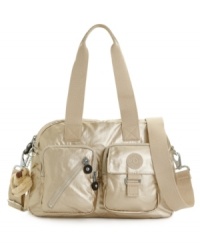 A chic convertible silhouette from Kipling that's both functional and fashionable. Each Kipling bag is crafted from water resistant nylon and features a collectible charm. A chic convertible silhouette from Kipling that's both functional and fashionable. Each Kipling bag is crafted from water resistant nylon and features a collectible charm.