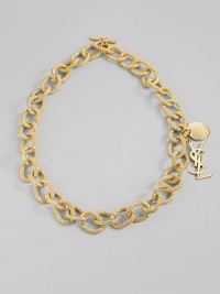 Bold, textured golded links are accented with two YSL logo charms. Goldtone Length, about 13 Toggle closure Made in Italy