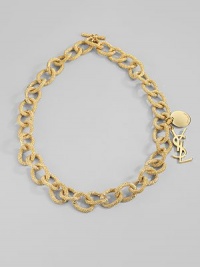 Bold, textured golded links are accented with two YSL logo charms. Goldtone Length, about 13 Toggle closure Made in Italy Bold, textured golded links are accented with two YSL logo charms. Goldtone Length, about 13 Toggle closure Made in Italy