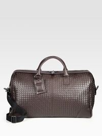 An elegant and efficient travel companion, spacious enough to carry all of your essentials in style, crafted in woven Italian leather.Zip closureTop handlesRemovable shoulder strapInterior zip pocketLeather22W x 14H x 9DMade in Italy