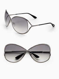 Oversized crossover metal frame with open temple and floating lens. Available in shiny gunmetal with smoke gradient lens.100% UV protection Made in Italy Oversized crossover metal frame with open temple and floating lens. Available in shiny gunmetal with smoke gradient lens.100% UV protection Made in Italy