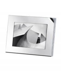 The Ambiray picture frame from Swarovski presents sleek, stainless steel heightened with dozens of tiny faceted clear crystals along its edge, creating a home accent that truly radiates glamour and sophistication. The Ambiray picture frame from Swarovski presents sleek, stainless steel heightened with dozens of tiny faceted clear crystals along its edge, creating a home accent that truly radiates glamour and sophistication.