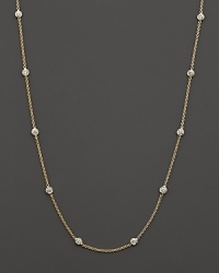 Diamond stations punctuate a long, elegant 18K yellow gold chain. By Roberto Coin. Diamond stations punctuate a long, elegant 18K yellow gold chain. By Roberto Coin.