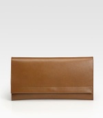 A sleek envelope bag crafted from rich, butter-smooth leather with a contrast exterior pocket on the back.Flap snap closureContrast flat card holder slips into back pocket9½W X 6H X 1½DMade in Italy