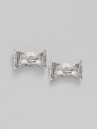 Fluted bows create an ultra feminine look in these silvery studs.Silvertone Width, about ¾ Post back Imported Fluted bows create an ultra feminine look in these silvery studs.Silvertone Width, about ¾ Post back Imported