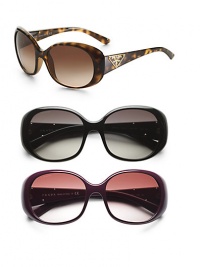 Oval, plastic frames with metal Prada triangle logo at temple. Available in tortoise with brown lens, black with grey lens or violet with lavender gradient lens. UV 400 lens 100% UV protection Made in Italy Oval, plastic frames with metal Prada triangle logo at temple. Available in tortoise with brown lens, black with grey lens or violet with lavender gradient lens. UV 400 lens 100% UV protection Made in Italy