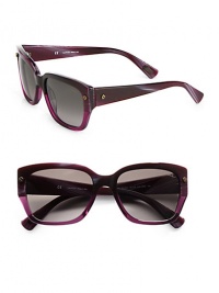 A classic shape in glossy resin accented with subtle rivet details. Available in shiny havana with brown gradient lens or shiny violet with smoke gradient lens. Rivet accents100% UV protectionMade in Italy 