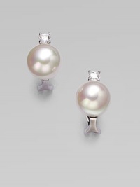 A classic design with a hint of sparkle for a truly versatile piece. 12mm round white organic man-made pearlsCubic zirconiaSterling silverSize, about ¼Post clip backImported A classic design with a hint of sparkle for a truly versatile piece. 12mm round white organic man-made pearlsCubic zirconiaSterling silverSize, about ¼Post clip backImported