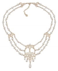 A true dazzler. Embellished with glittering stone accents and glass pearls, you'll strike a chord in this swag frontal necklace from Carolee. Crafted in gold tone mixed metal. Approximate length: 17 inches + 2-inch extender. A true dazzler. Embellished with glittering stone accents and glass pearls, you'll strike a chord in this swag frontal necklace from Carolee. Crafted in gold tone mixed metal. Approximate length: 17 inches + 2-inch extender.