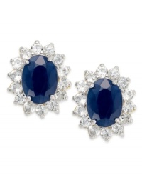 Regale yourself with something regal. Victoria Townsend's royalty-inspired stud earrings feature oval-cut sapphires (3 ct. t.w.) encircled by round-cut white topaz (1-1/10 ct. t.w.). Set in 18k gold over sterling silver. Approximate diameter: 1/2 inch. Regale yourself with something regal. Victoria Townsend's royalty-inspired stud earrings feature oval-cut sapphires (3 ct. t.w.) encircled by round-cut white topaz (1-1/10 ct. t.w.). Set in 18k gold over sterling silver. Approximate diameter: 1/2 inch.