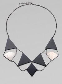 This striking two-tone statement piece offers geometric brass plaques chained together in a fascinating pattern.BrassHematite and black powdercoat finishesHematite-finish chainLength, about 30½ with extenderWidth, about 3½Lobster claspMade in USA This striking two-tone statement piece offers geometric brass plaques chained together in a fascinating pattern.BrassHematite and black powdercoat finishesHematite-finish chainLength, about 30½ with extenderWidth, about 3½Lobster claspMade in USA