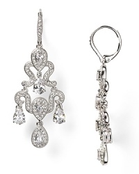 Designed to make an impression, these Nadri chandelier earrings flaunt a dramatic cascade of crystals, set off by rhodium plated metal. Designed to make an impression, these Nadri chandelier earrings flaunt a dramatic cascade of crystals, set off by rhodium plated metal.