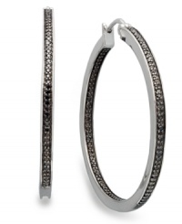 Bolder and better. Black diamonds are the latest craze in fine jewelry and these round-cut black diamond hoop earrings (1/2 ct. t.w.) will add the perfect touch to your collection. Set in sterling silver. Approximate diameter: 1-1/2 inches. Bolder and better. Black diamonds are the latest craze in fine jewelry and these round-cut black diamond hoop earrings (1/2 ct. t.w.) will add the perfect touch to your collection. Set in sterling silver. Approximate diameter: 1-1/2 inches.