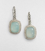 From the Noblesse Collection. A pretty aqua chalcedony cabochon center surrounded by a diamond accented border set in sleek sterling silver. Aqua chalcedonyDiamonds, .42 tcwSterling silverLength, about .39Hook backImported 