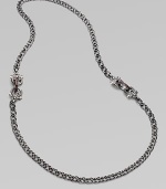 From the Jewels Verne Collection. A bold woven chain of sterling silver with a black rhodium finish has pretty filigree links with red garnet and goldplated accents.Red garnetBlack rhodium-plated sterling silver and rose goldplated sterling silverLength, about 26Imported