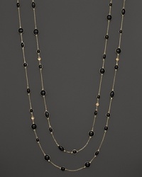 Round and oval grey enamel stations and a diamond highlight this gold chain necklace. Round and oval grey enamel stations and a diamond highlight this gold chain necklace.